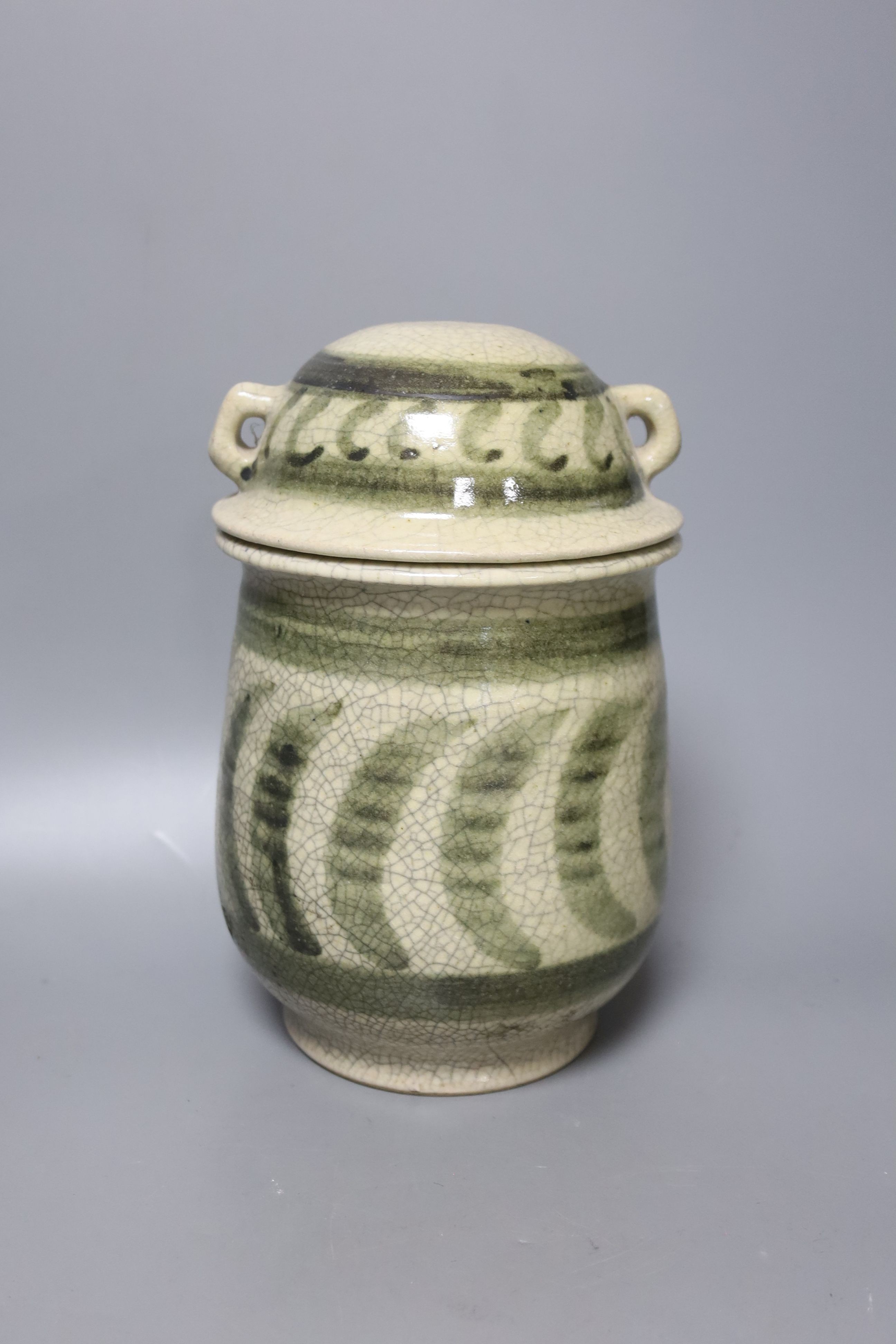 Andrew Rudebeck. A studio glass jar and cover, 22cm, and three further studio pottery jars